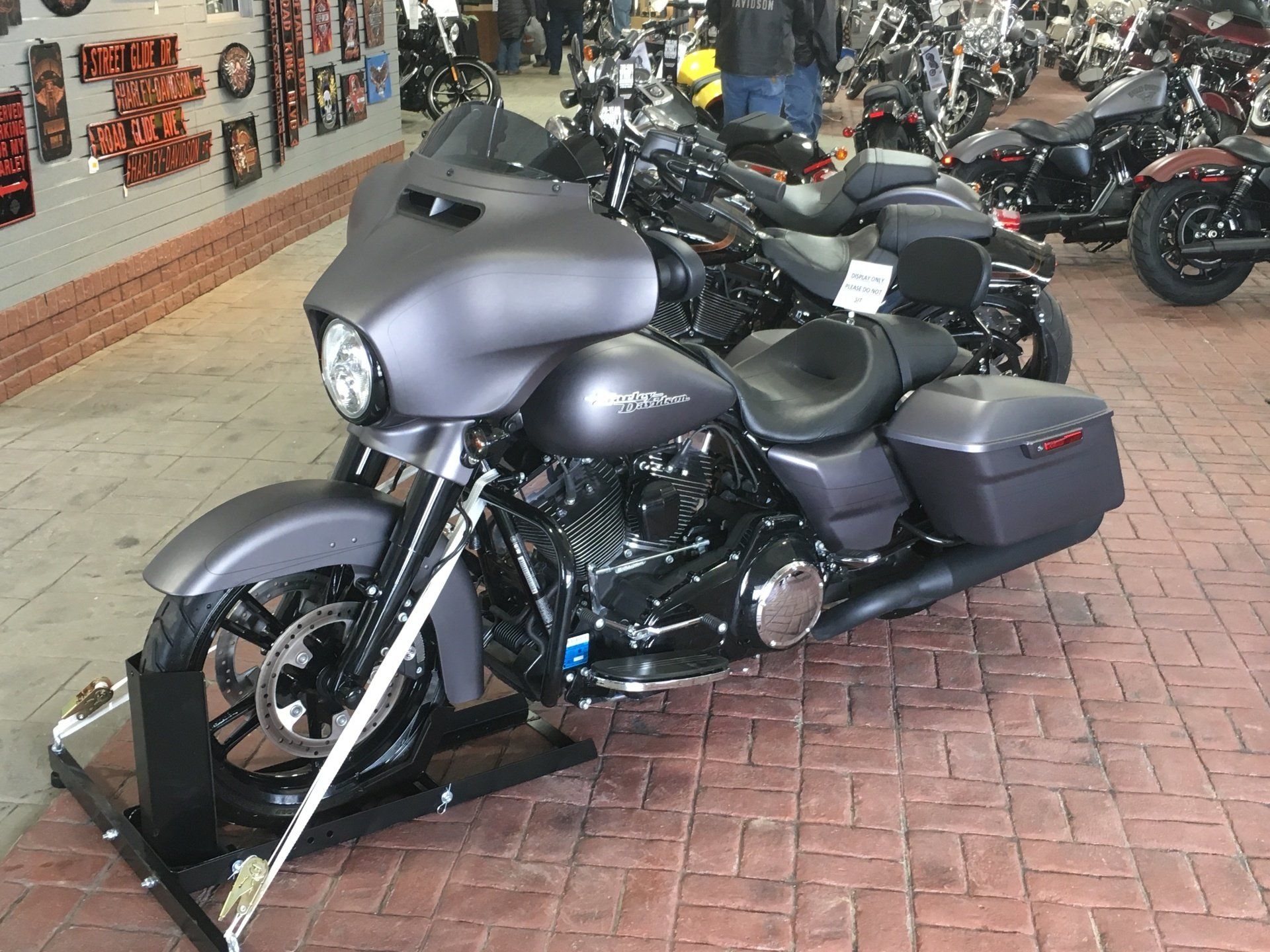 A harley davidson motorcycle is parked in a showroom