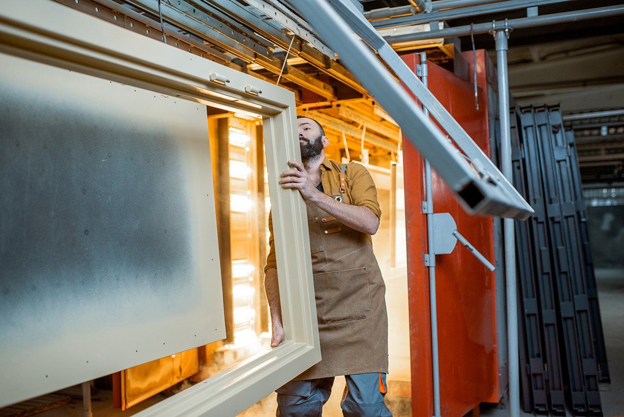 painting shop worker checking quality painted