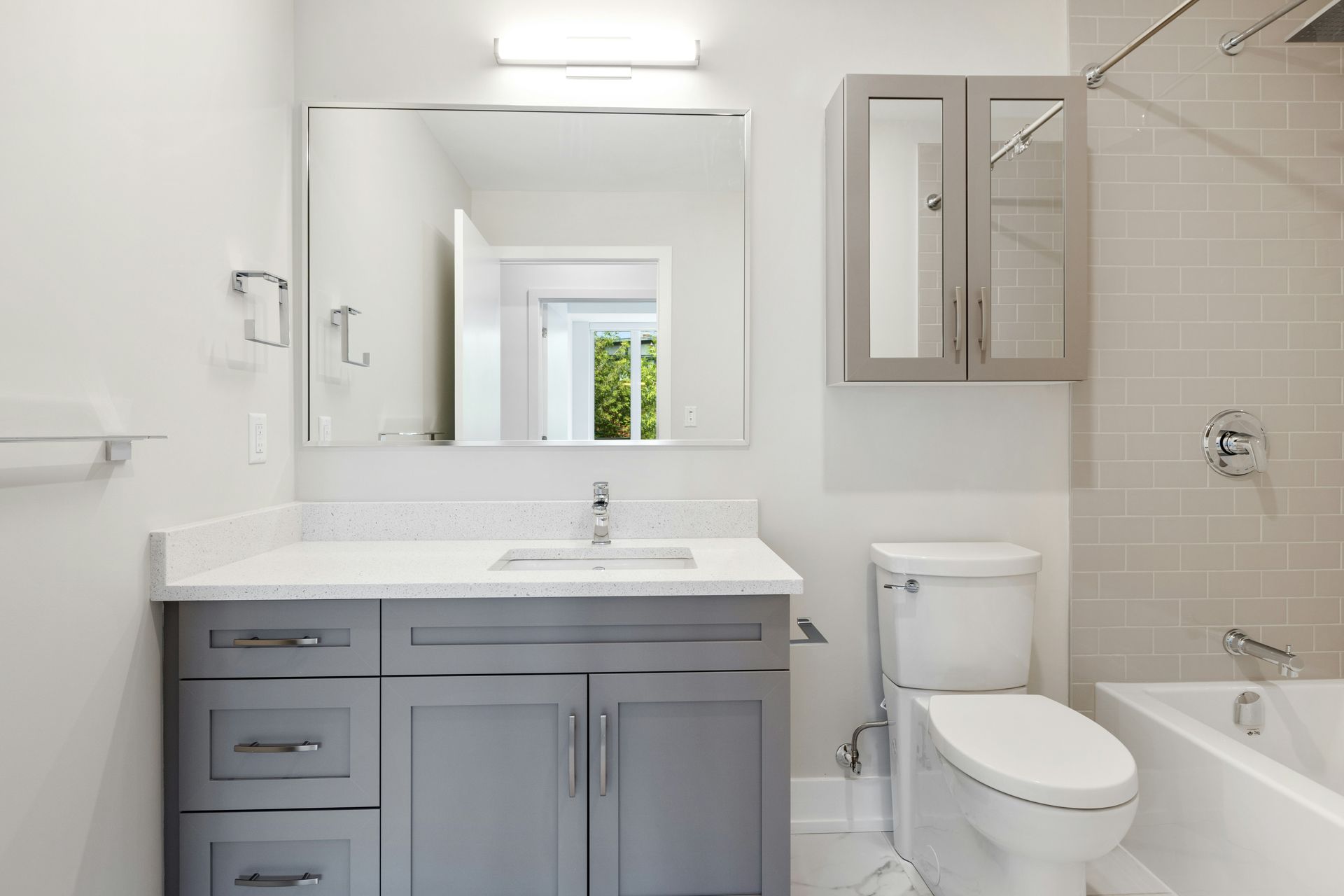 Clean bathroom with existing toilet and vanity in a Boise, Idaho home serviced by A1 Handyman
