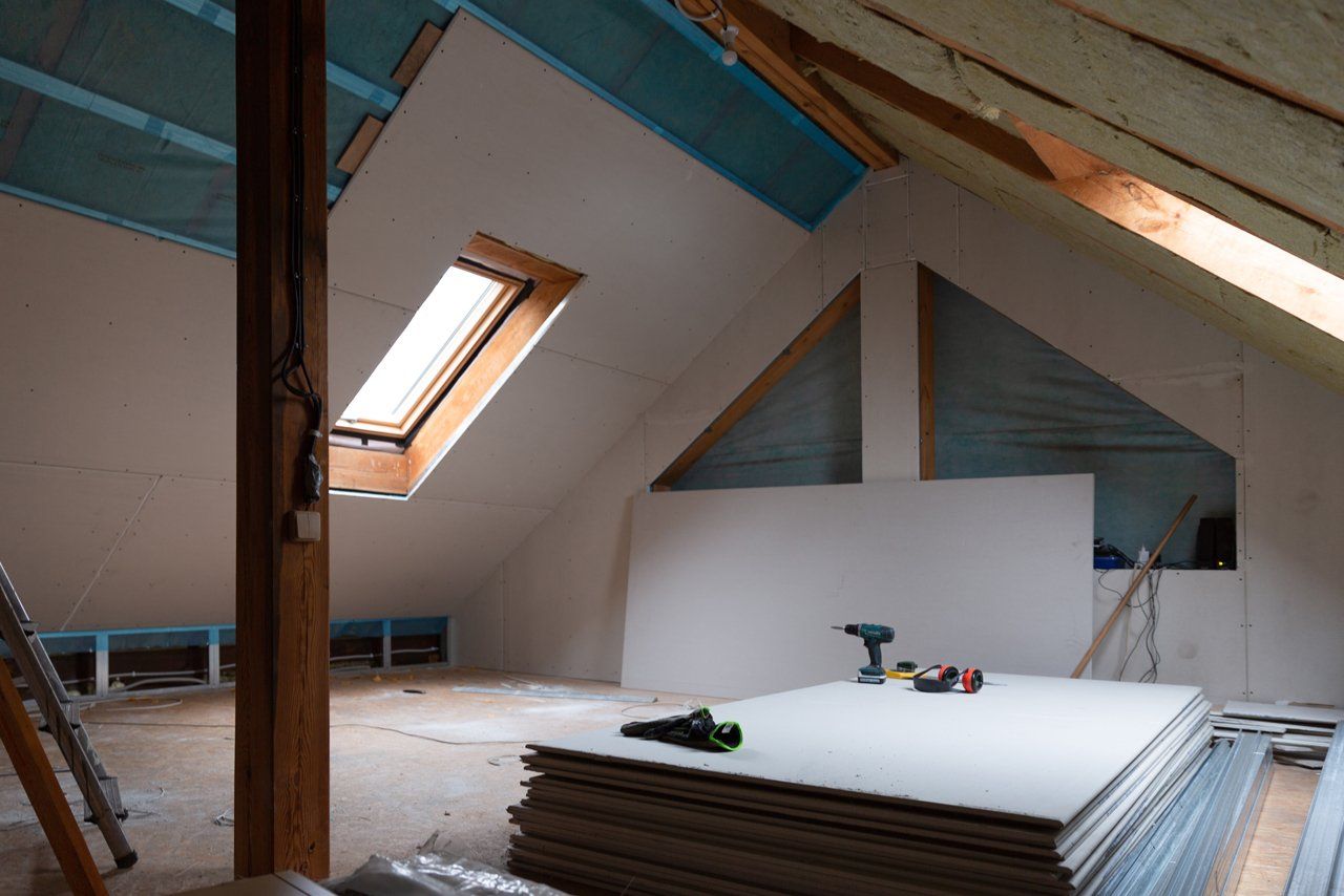 Finished attic space with installed flooring prepared for safe access after attic ladder installation in Boise, ID