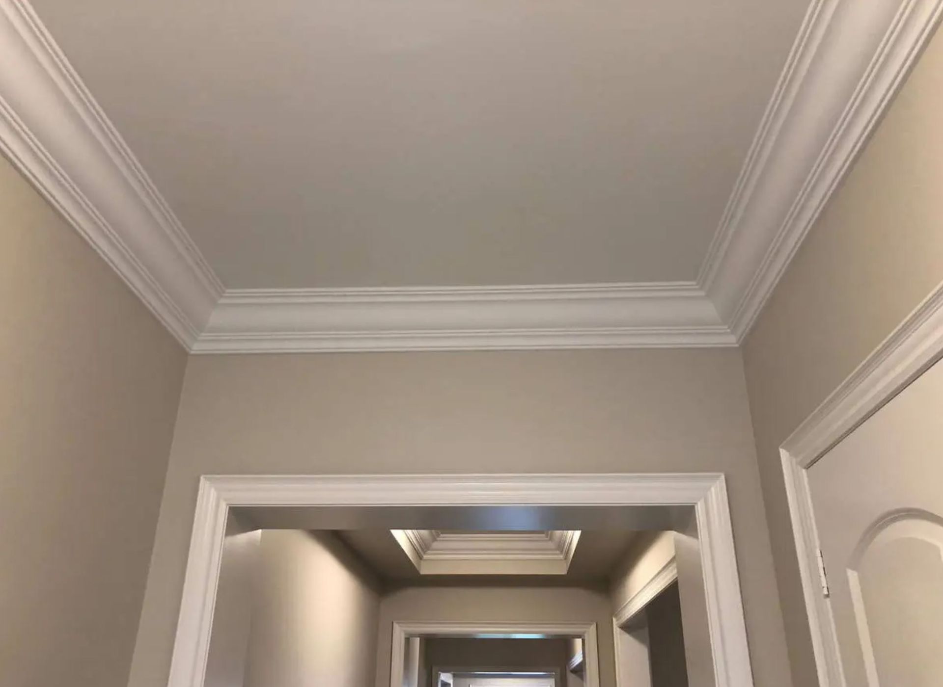 Crown molding and interior trim installation with clean corners and smooth ceiling transitions