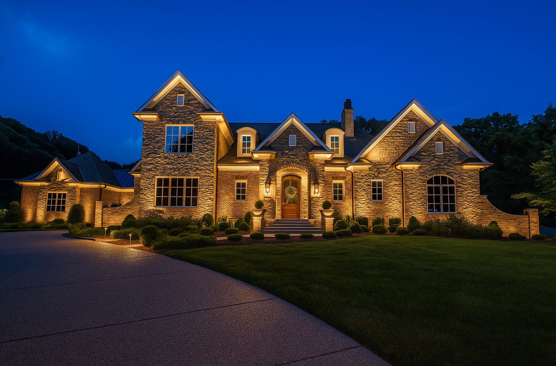 Elegant stone home in Boise, ID with professionally installed outdoor lighting by A1 Handyman