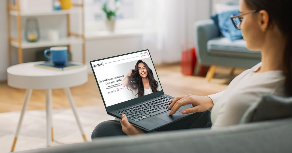 Patient browsing dental website on laptop, illustrating how effective websites for dentists can increase patient bookings online.