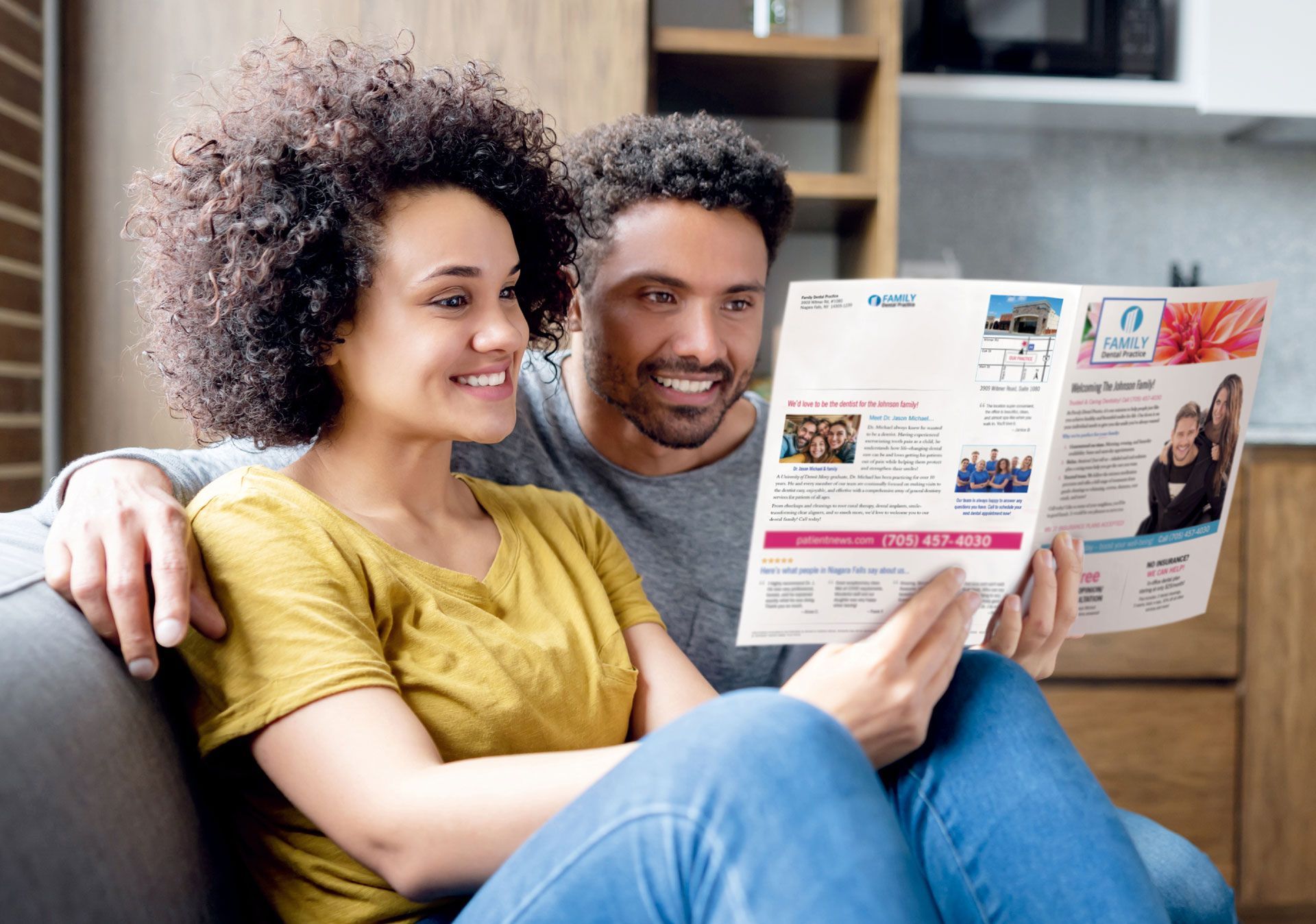 Couple reading a healthcare marketing brochure at home.