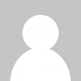 A silhouette of a person without a face on a gray background.