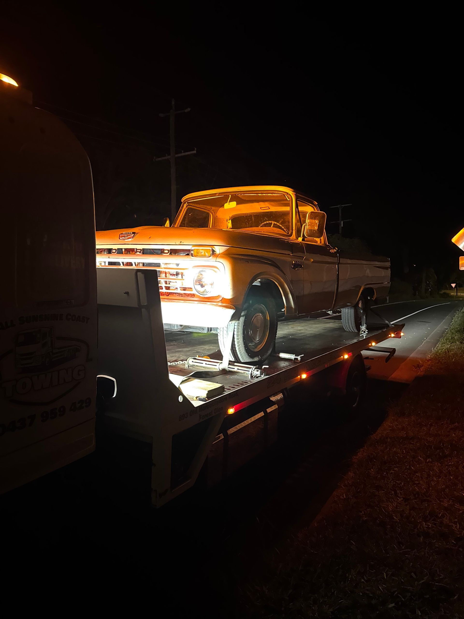 White Pickup Truck on a Tow Truck at Night — All Sunshine Coast Towing In Forest Glen, QLD