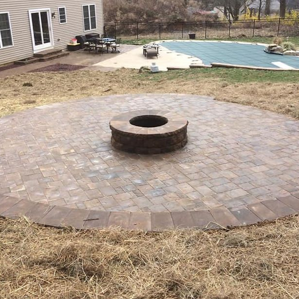 Four vertical stone samples in beige, gray, blue, and reddish brown