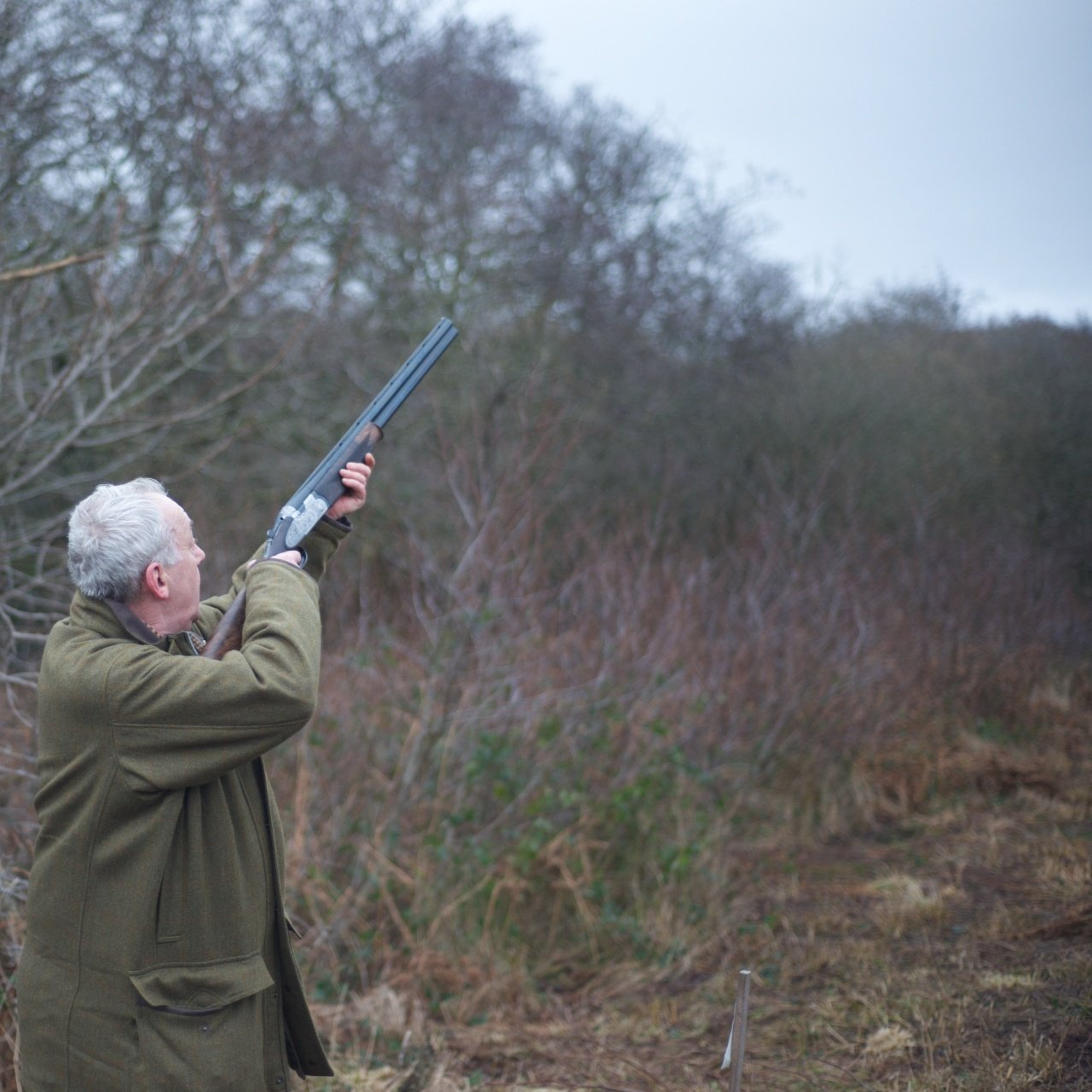 Man holding shotgun. Rawlins Outdoor Shooting Complex.