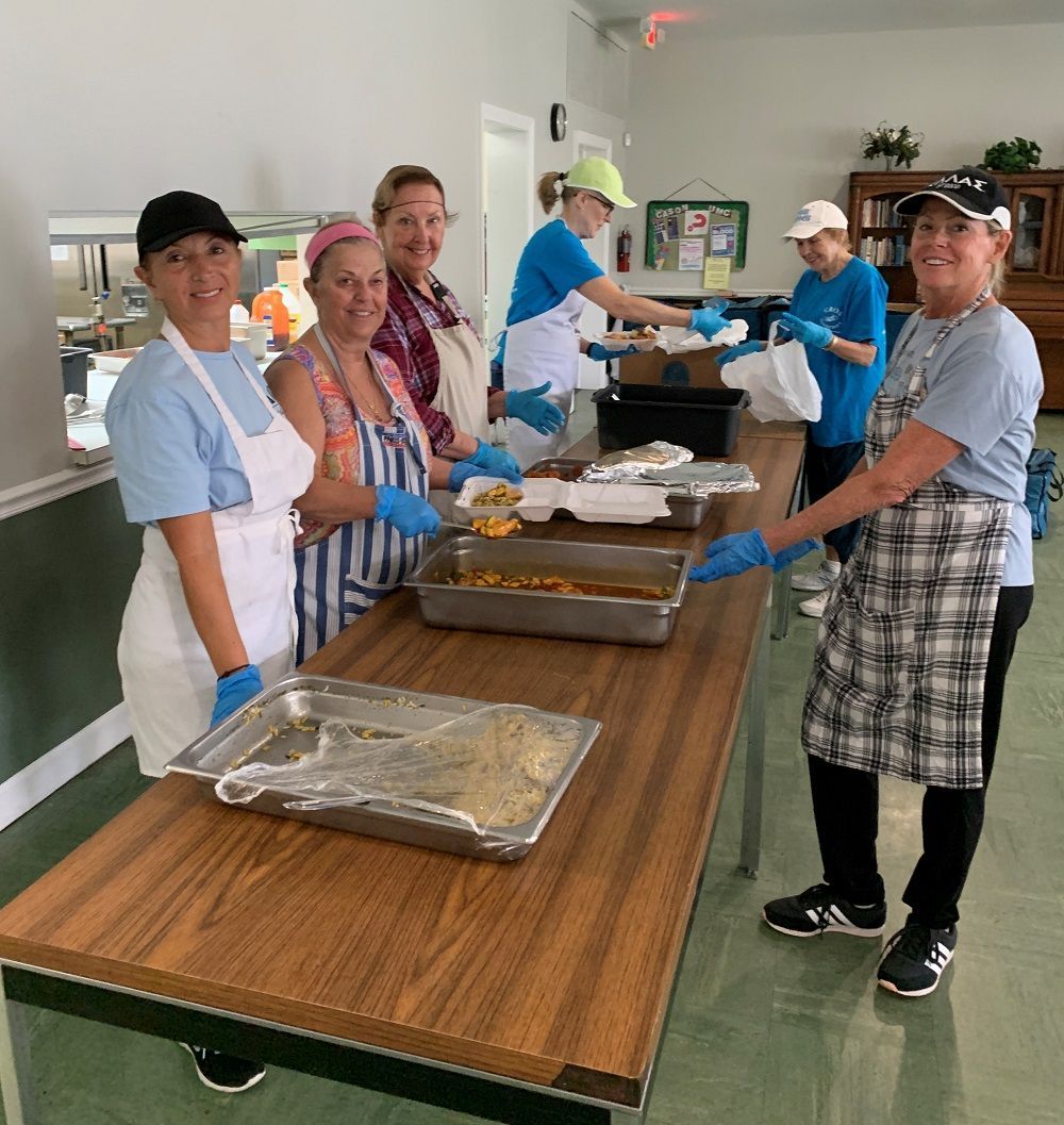 Volunteers preparing meals for distribution.