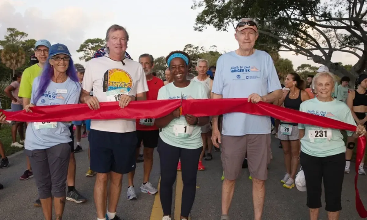 Hustle to End Hunger 5K logo