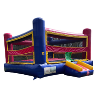 A red and blue bouncy house with a slide attached to it.