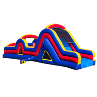 A blue , red , and yellow inflatable obstacle course with a slide.