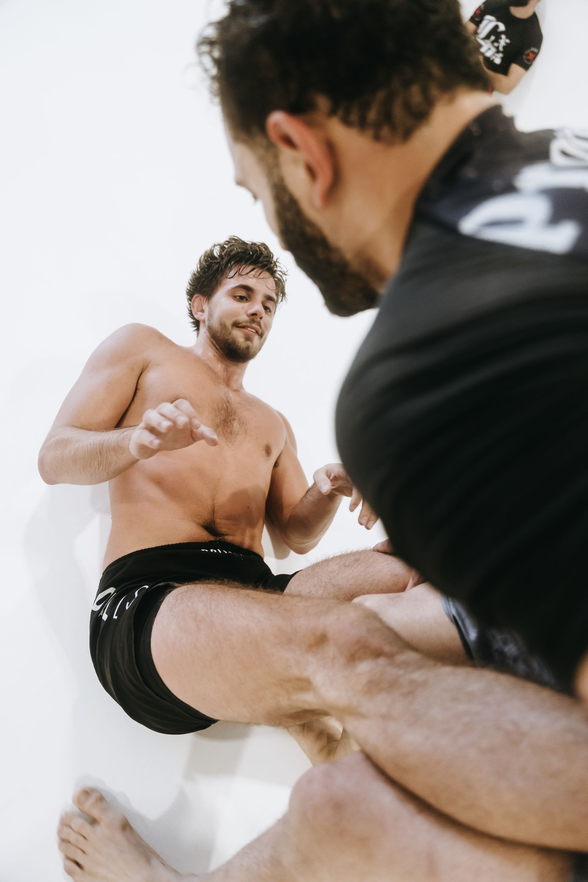 Family partners practicing No-Gi Jiu Jitsu at Jiu Jitsu Hub in Georgetown, Texas.
