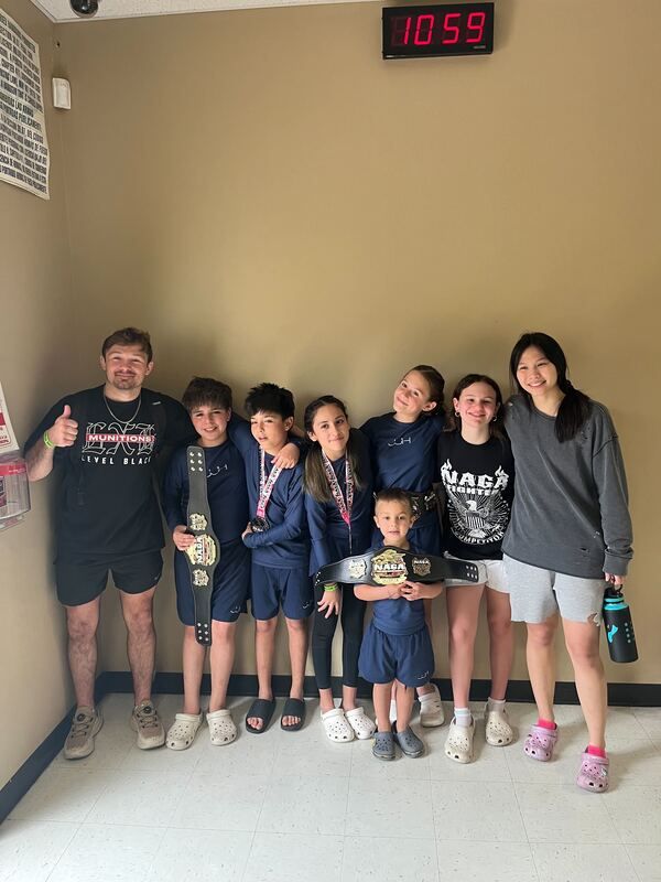 No-gi students drilling calm, controlled grappling at Jiu Jitsu Hub in Georgetown, Texas.