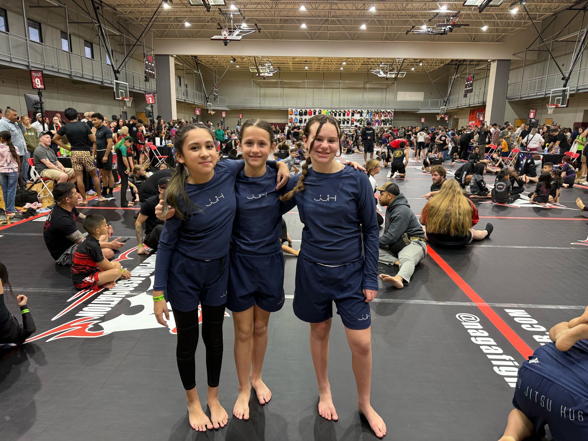 Adults and kids practicing Jiu-Jitsu at Jiu-Jitsu Hub in Georgetown, Texas, building calm focus.