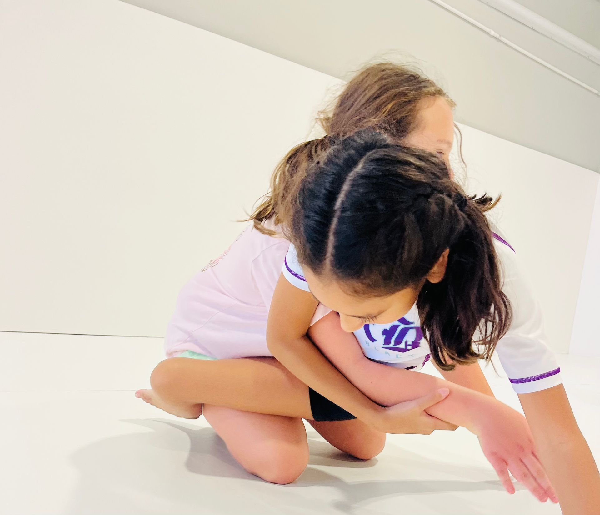 Kids practicing safe grappling drills at Jiu-Jitsu Hub in Georgetown, Texas, building confidence.