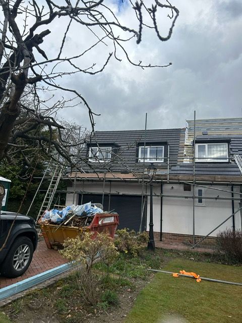 work vans outside a property