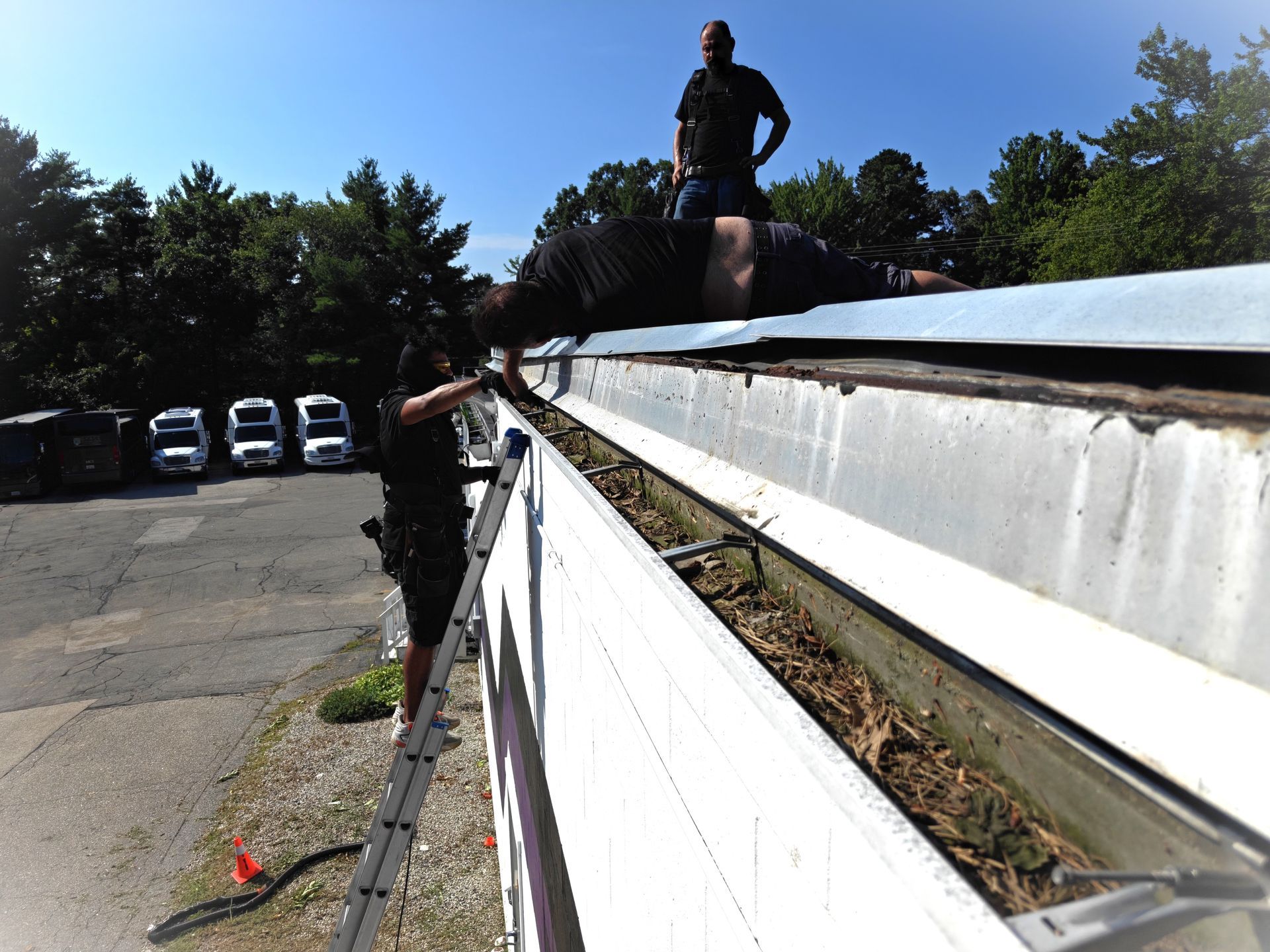 Installing 6-inch seamless gutters on a small business in Manchester, New Hampshire