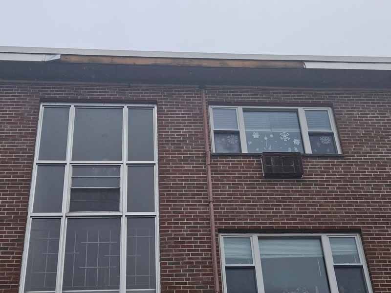 A brick building with a lot of windows on it.