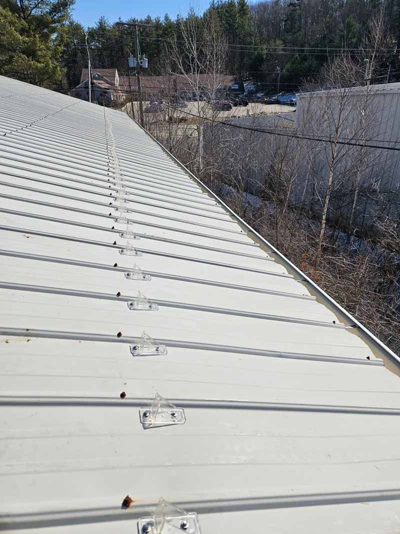 A white roof with a lot of shingles on it.