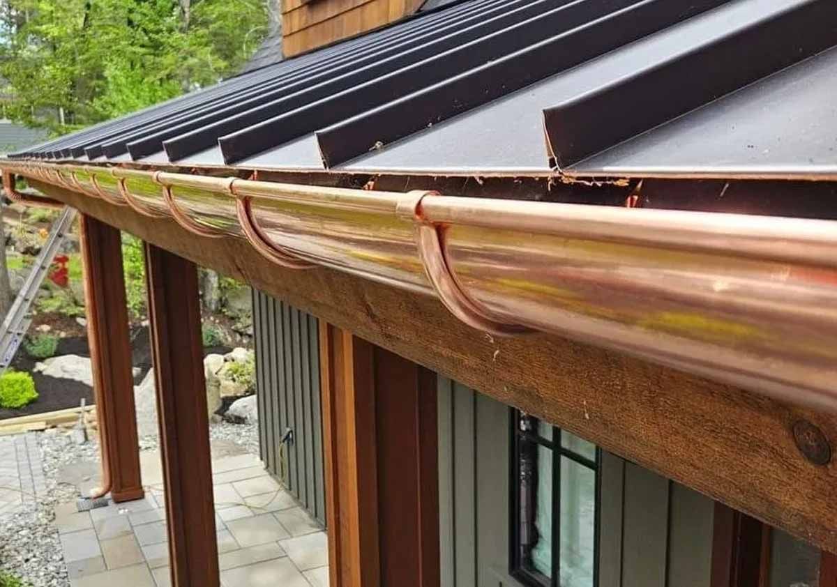 Heavy-duty, high-capacity gutters are essential in Alton Bay, NH, to manage intense New England weather, specifically heavy snow, ice dams, and heavy rainfall. Robust gutters prevent water from overflowing, protecting home foundations, landscaping, siding, and fascia from rot and damage, while standing up to debris from trees. 