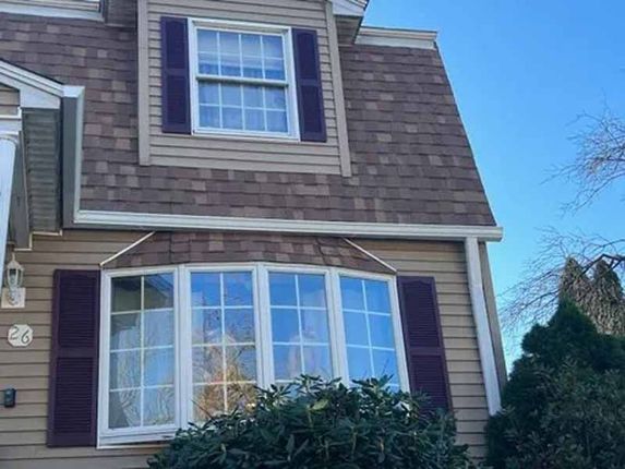 Seamless K-style aluminum gutters installed on traditional New Hampshire home