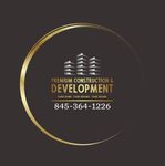Logo for Premium Construction & Development, gold circle, buildings, phone number.