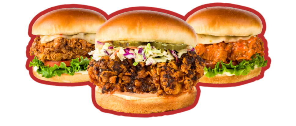 Three chicken sandwiches are sitting on top of each other on a bun.
