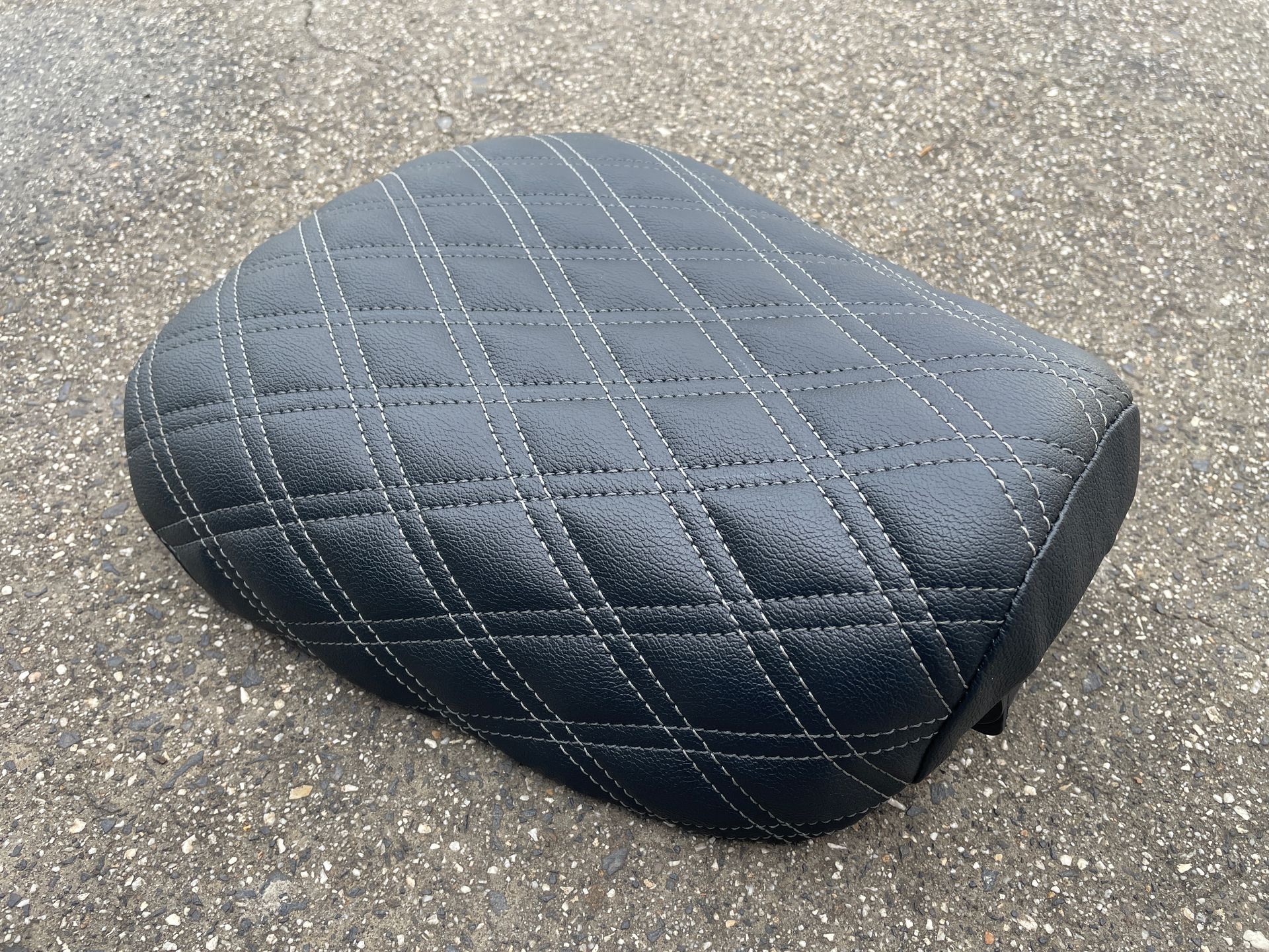 Postie bike seat shaved down in black vinyl with diamond stitching
