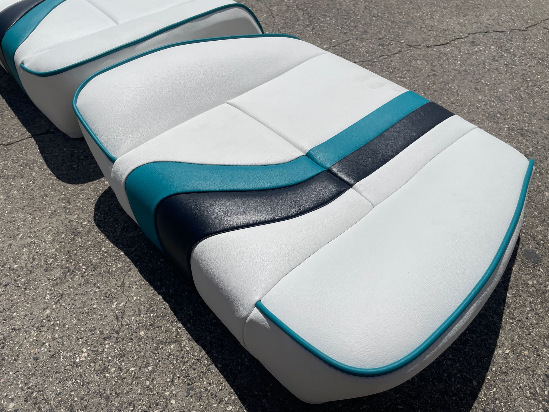 2002 Haines Signature boat seat bases in white, black and teal vinyl