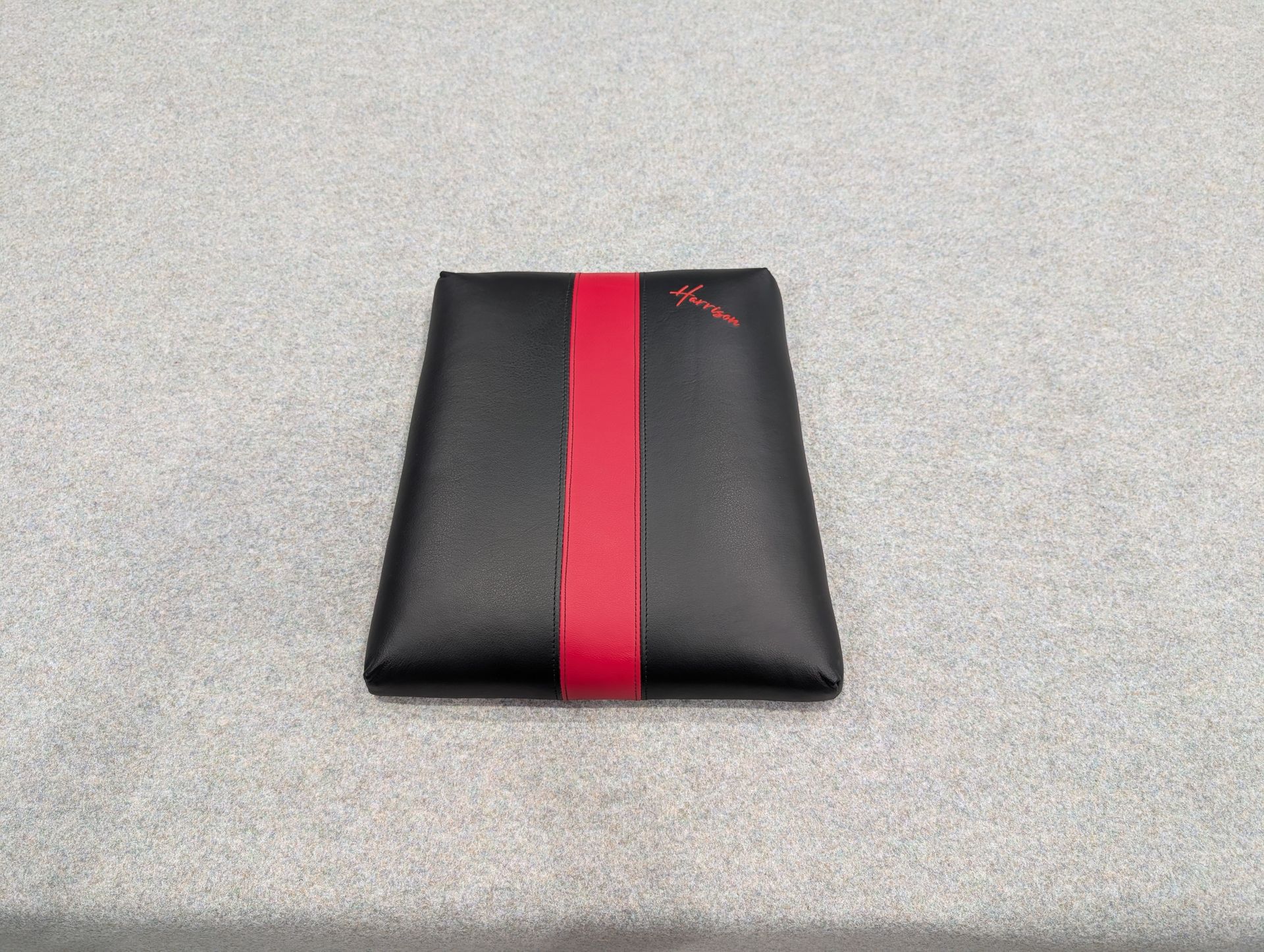 Embroidered black and red leather seat base with commercial grade foam