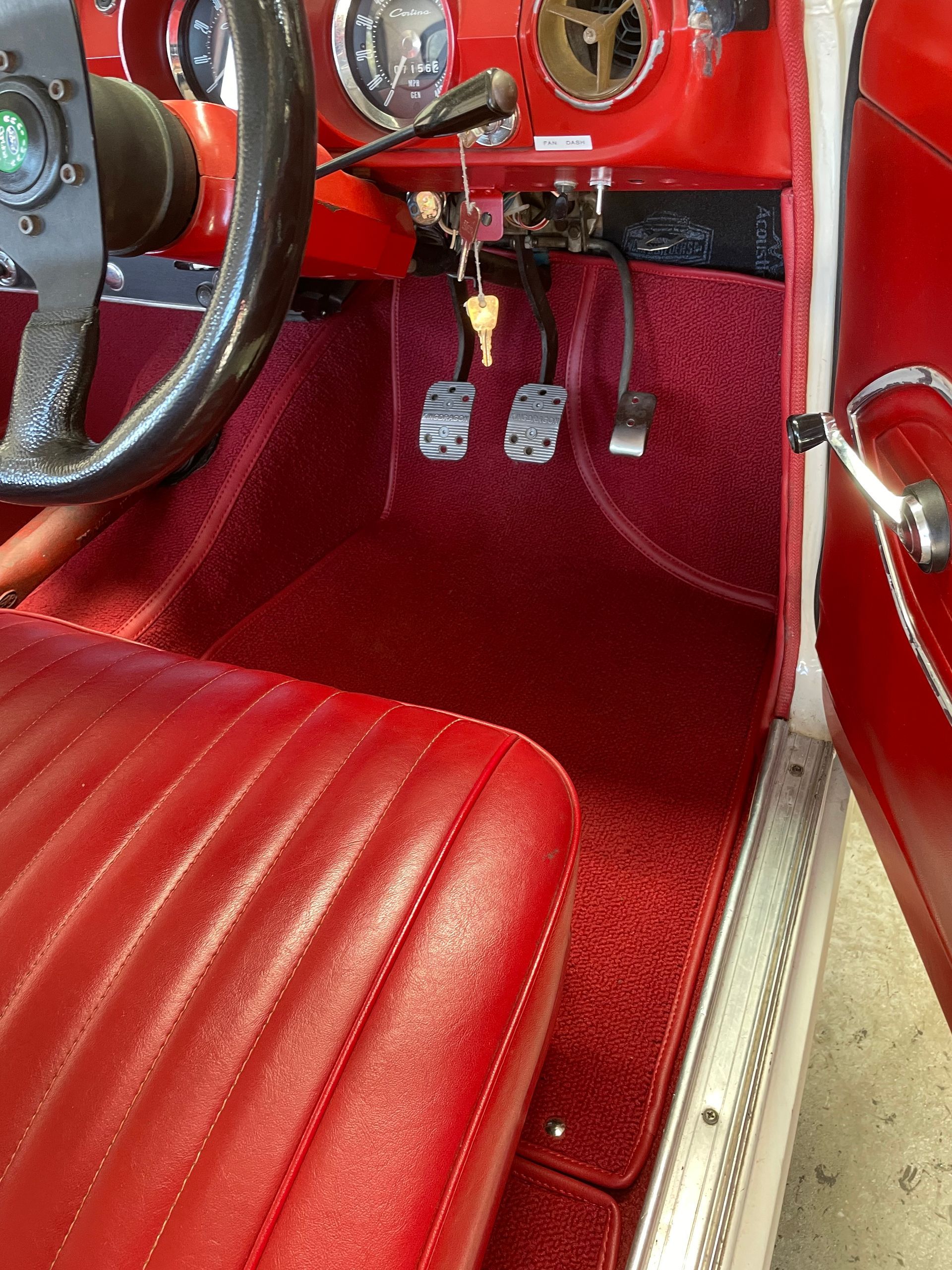 Custom cut and moulded red carpet with vinyl edge tape