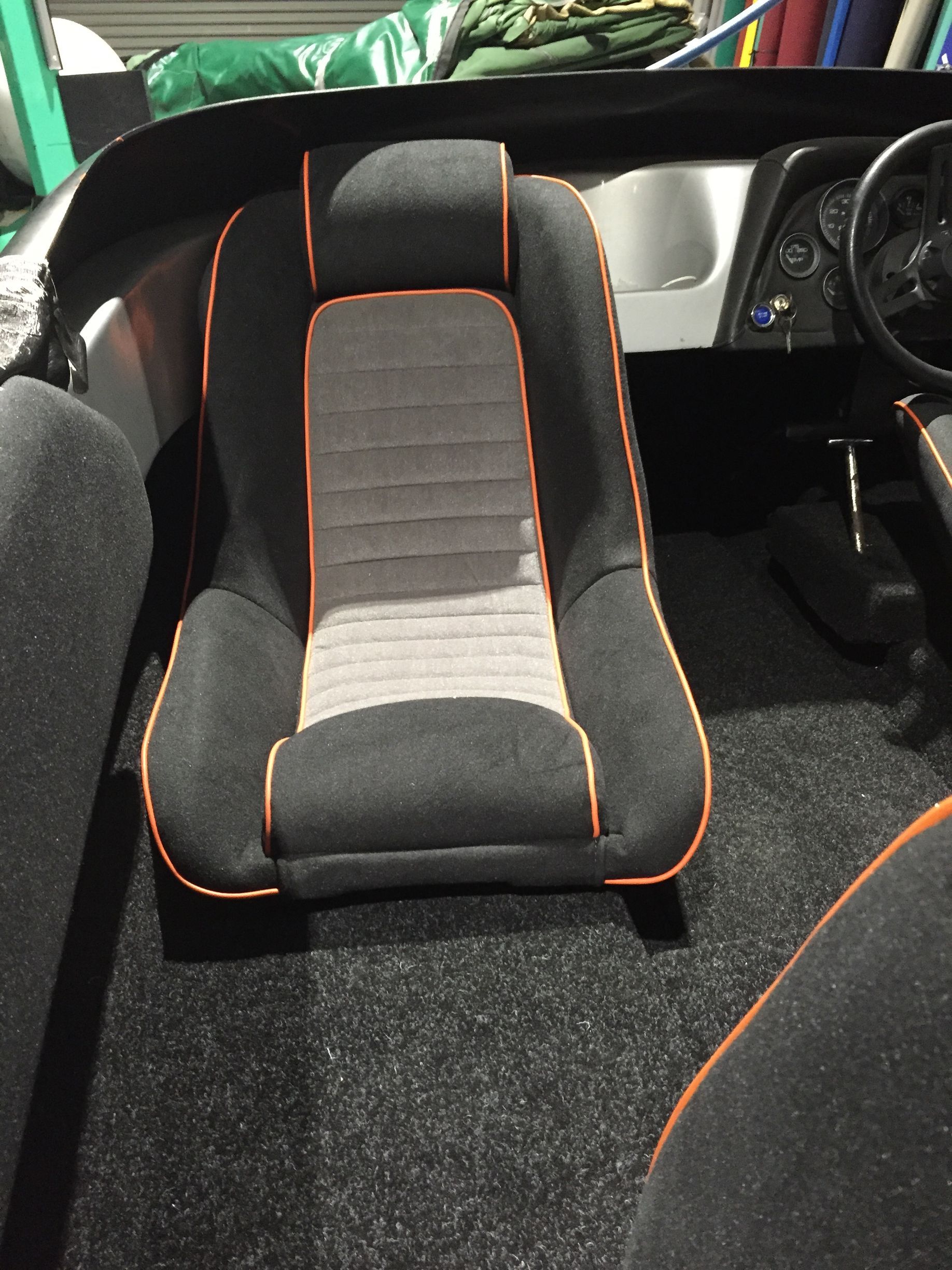 Inboard bucket seat