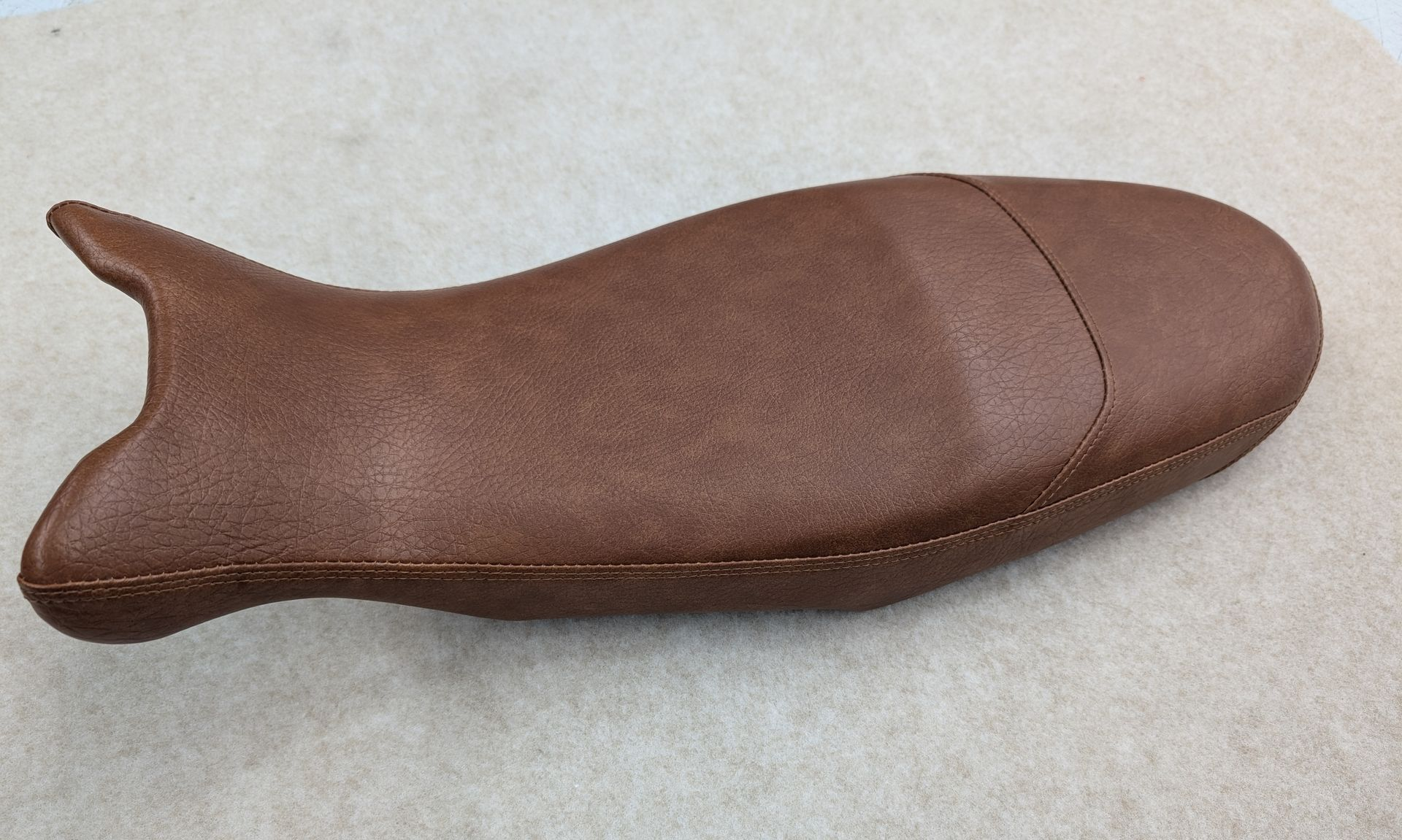 Recovered motorbike seat in saddle brown vinyl
