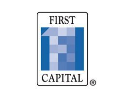 First Capital logo: Blue and white block letter
