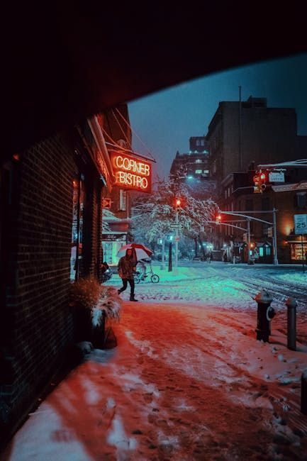 Snowy street scene. Neon sign 