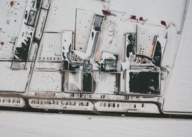 Snow accumulated on a flat commercial building roof in the Pacific Northwest
