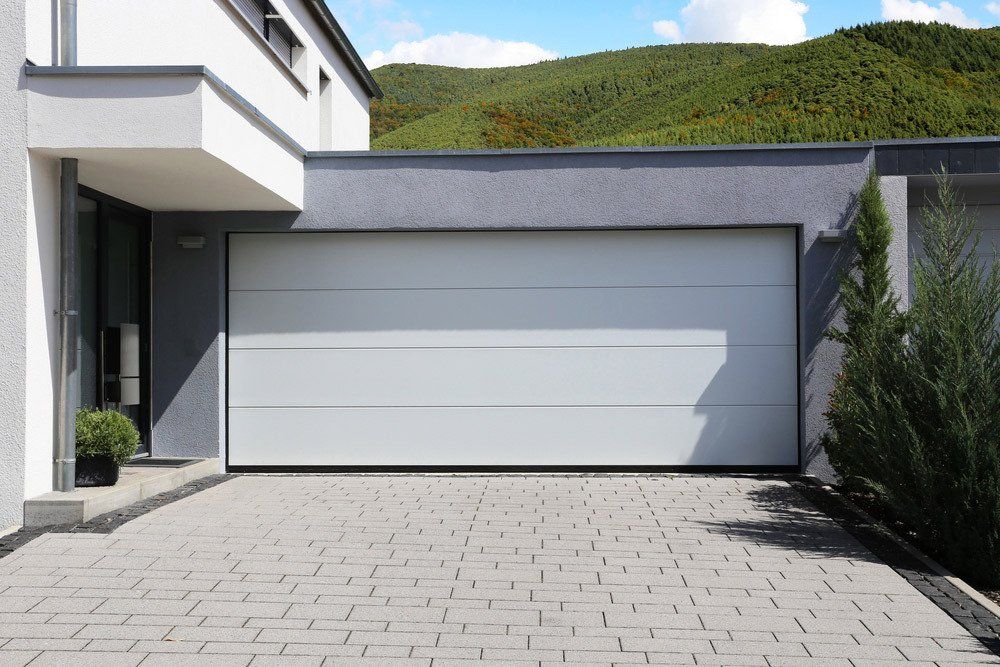 Modern White Sectional Garage Door — Darwin Roller Door Services In Tivendale NT