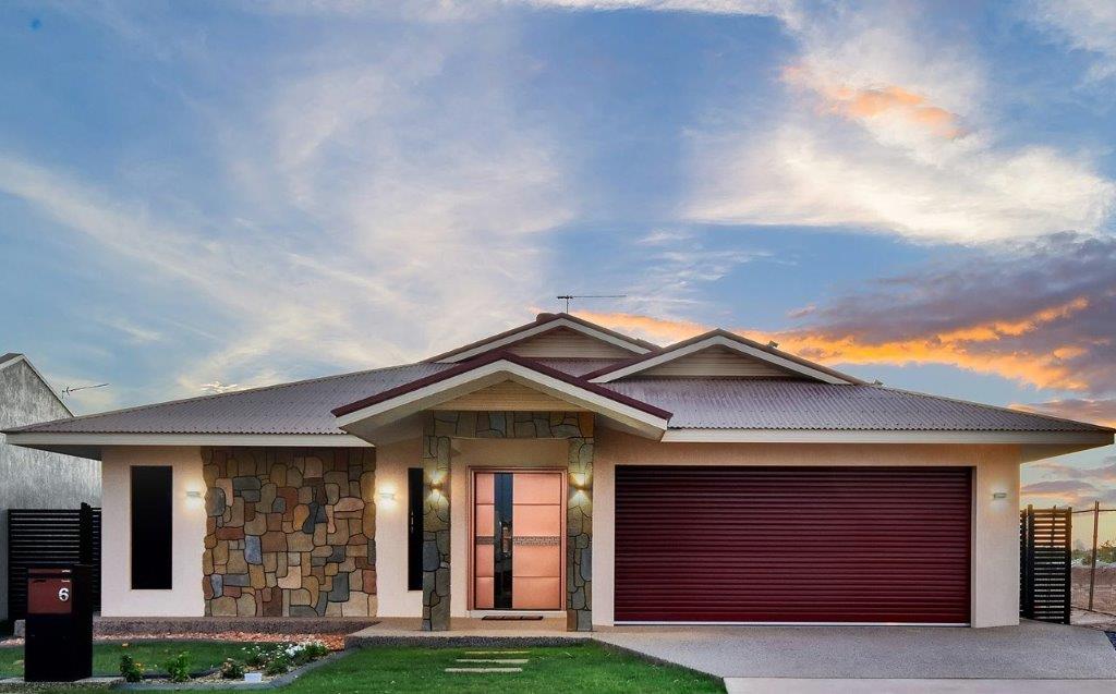 manor red garage roller door installed on new house
