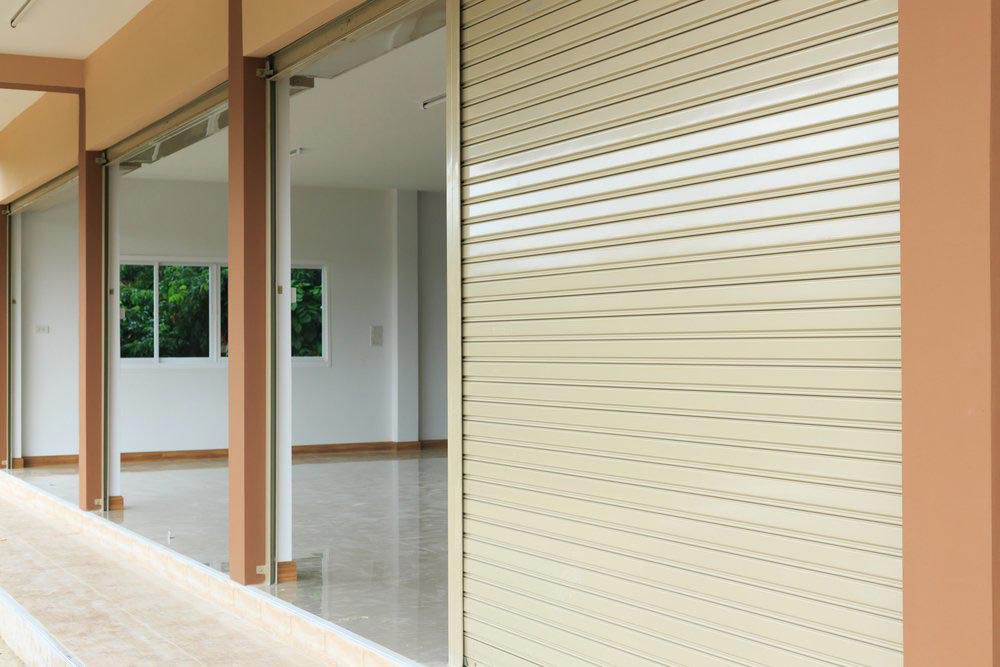 Beige Commercial Roller Shutters — Darwin Roller Door Services In Tivendale, NT