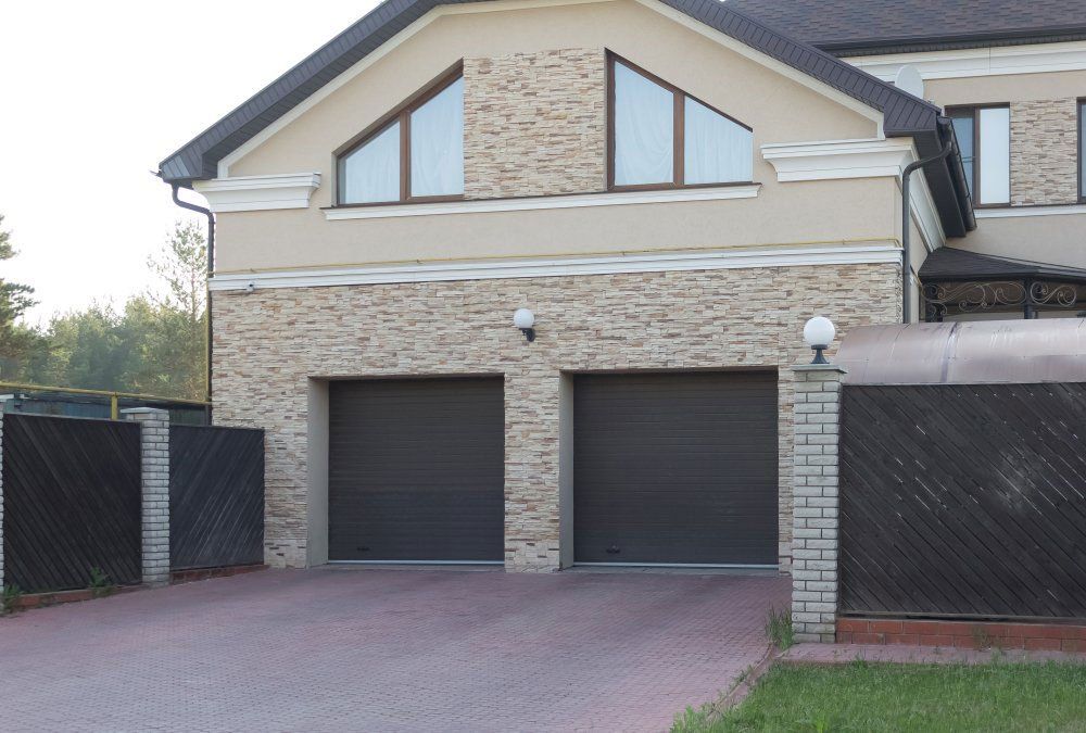 Two Black Garage Roller Doors — Darwin Roller Door Services In Tivendale, NT