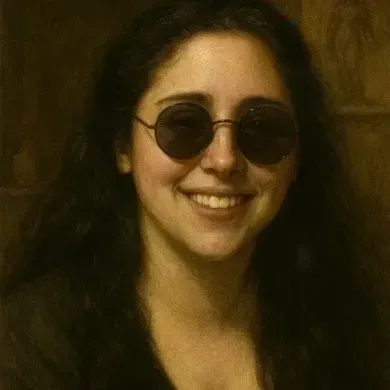 Smiling person wearing round sunglasses and dark clothing against a warm-toned background