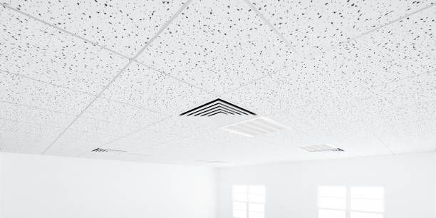 White ceiling with textured surface and recessed lighting. A triangular vent is visible.