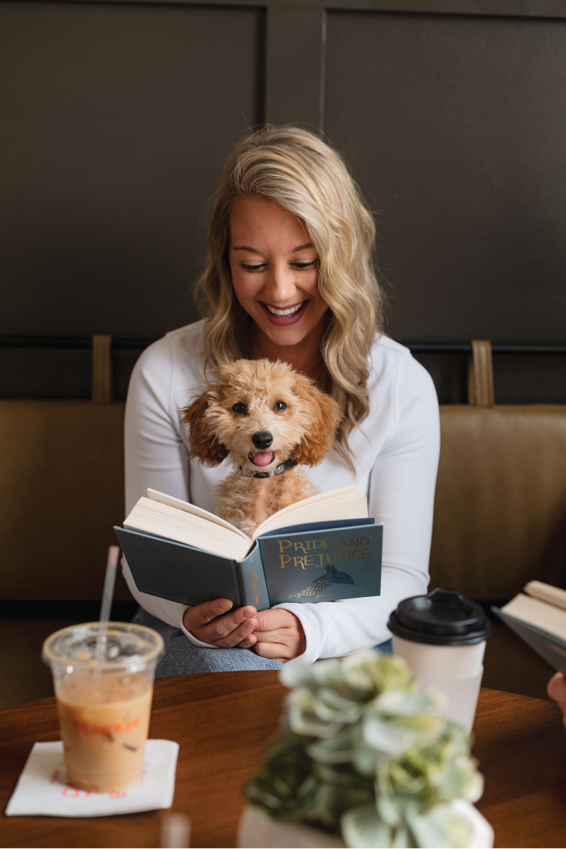 Livano Sunlake Resident reading with pet