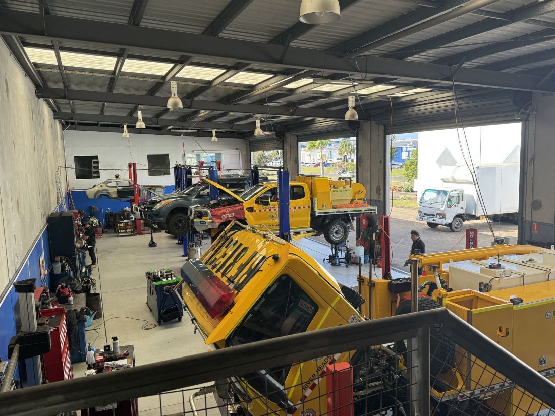 Vehicles Inside a Garage with Tools and Equipment Around — Pialba Brake Clutch & Steering Centre in Pialba, QLD
