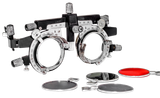 An optometry trial frame for vision testing with accompanying colored and opaque trial lenses on a white background.