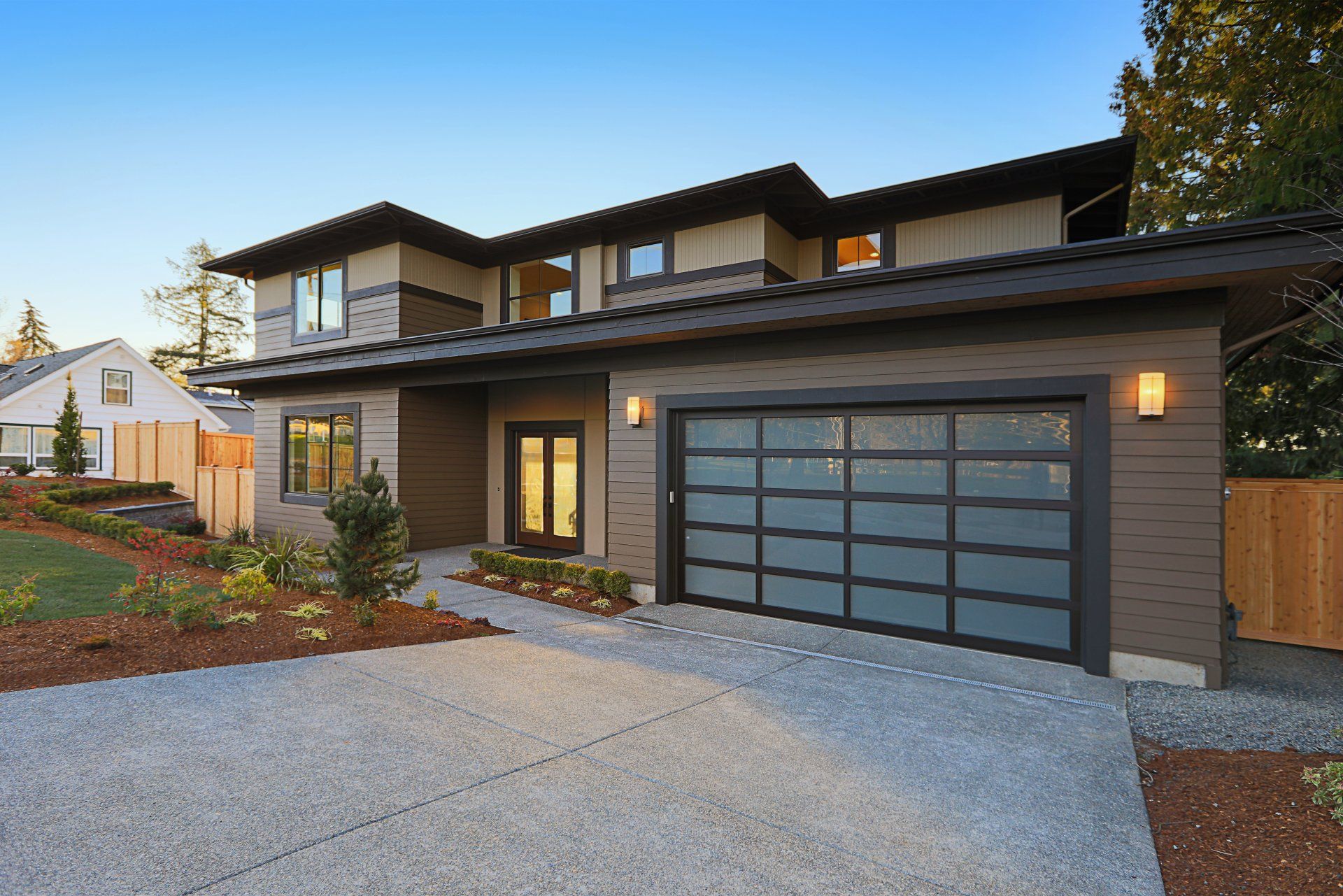 rown siding and glass garage door