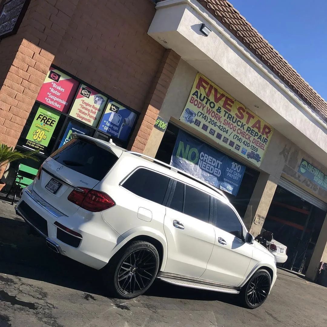 White car parked in front of Five Star Truck & Auto Repair in Anaheim, CA