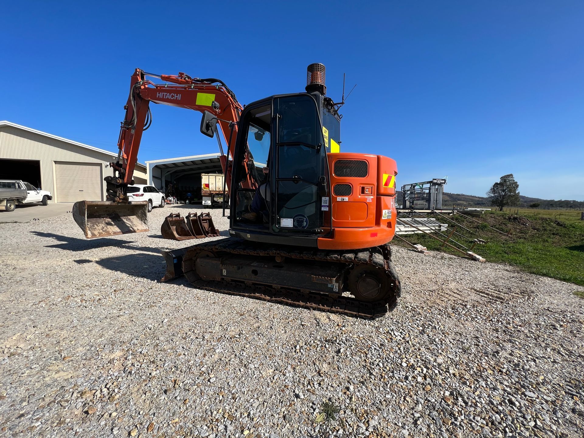 Yellow Mitsubishi Dump Truck and Small Excavator — MG Earthworks and Plant Hire in Gumma, NSW