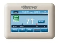 White Observer thermostat displaying the time, day, and current temperature.